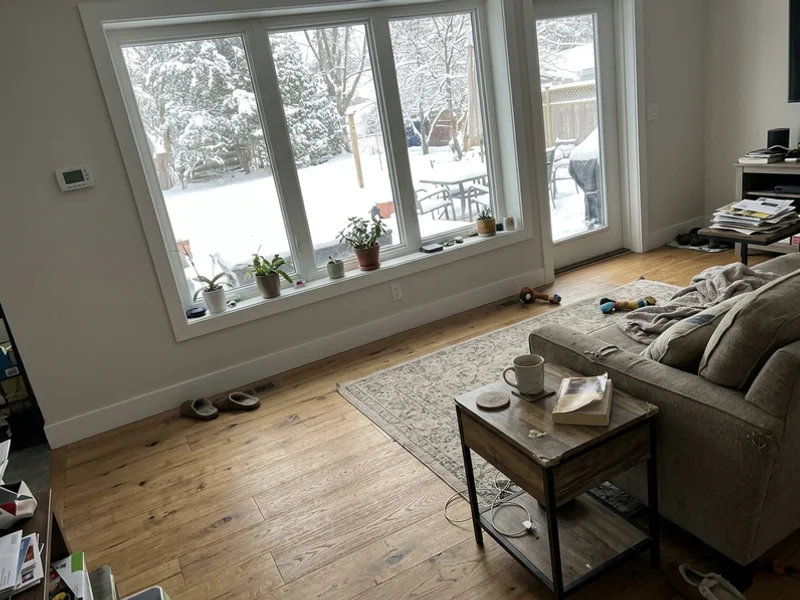 Bright living room with triple-pane windows in winter
