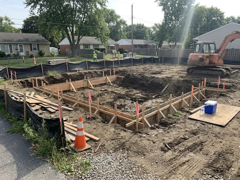 Excavation and footing forms on a Burlington lot