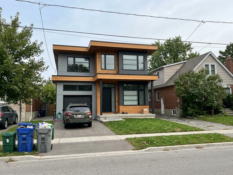 Flat-roof modern custom home in Waterdown at dusk