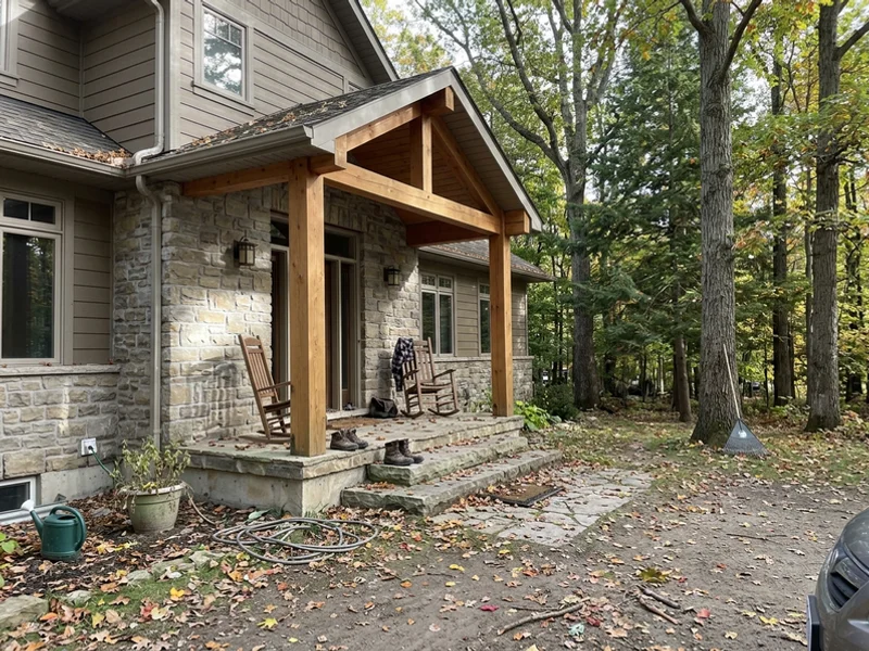 Luxury Craftsman estate home with stone and timber porch in Ancaster