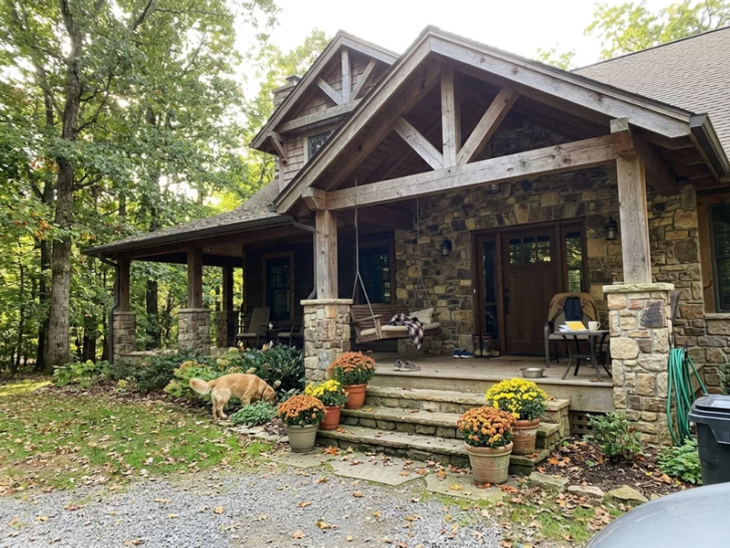 Luxury Craftsman estate home with stone and timber on an Ancaster lot