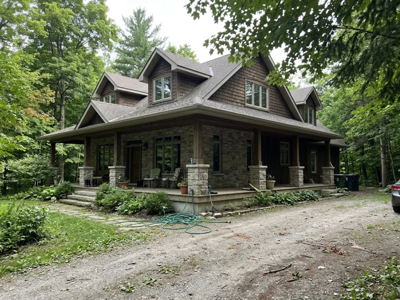 Luxury Craftsman estate home with wraparound porch in Ancaster