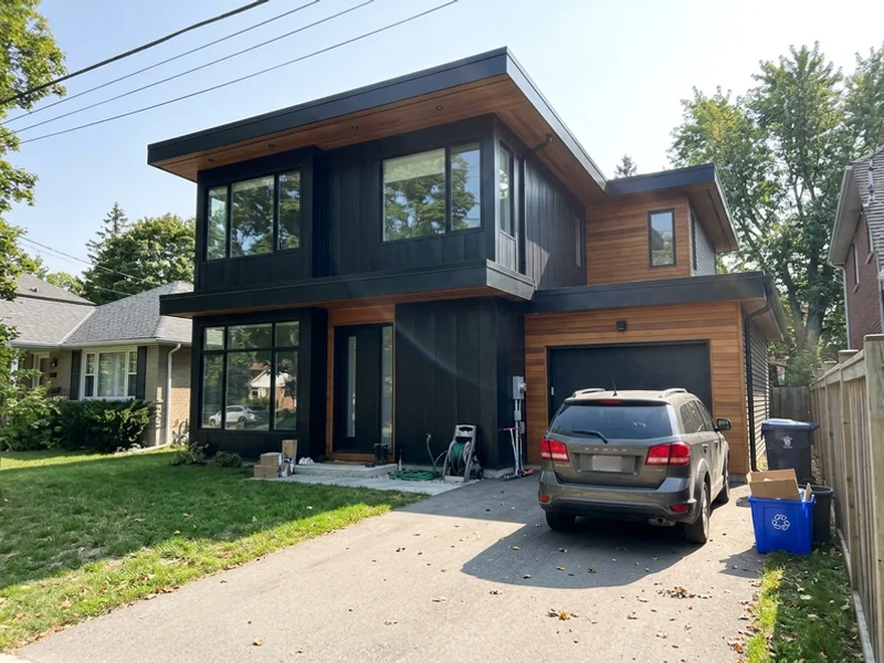 Modern custom home with blackened steel and cedar in Bronte, Oakville
