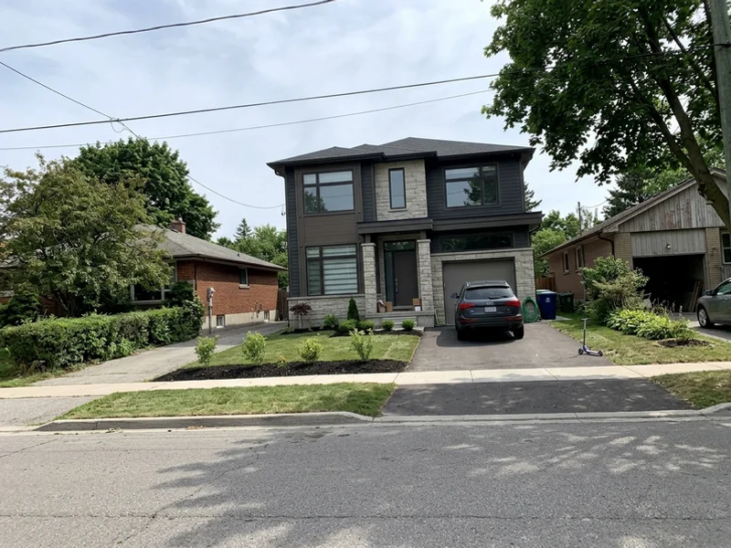 New infill custom home replacing a 1960s bungalow in Palmer, Burlington