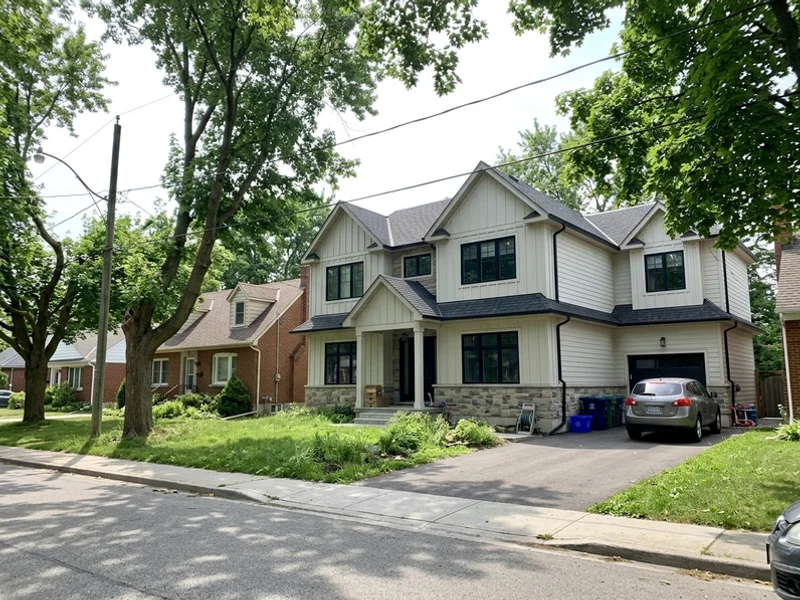 Transitional custom home stepped to match neighbouring rooflines