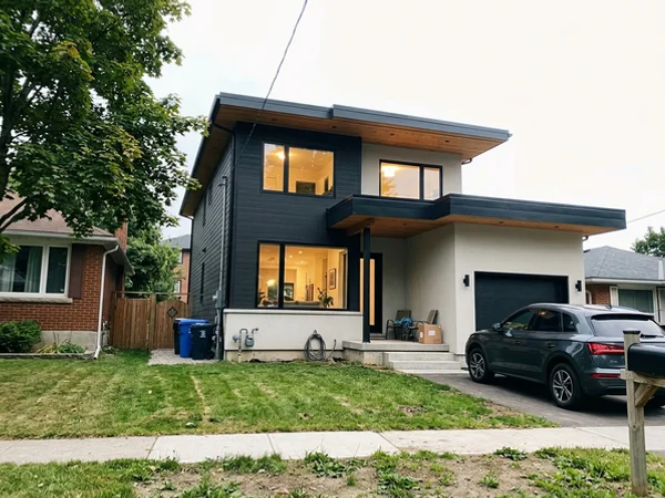 After: flat-roof modern custom home in Waterdown at dusk