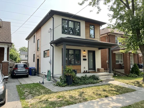 After: two-storey infill custom home in Palmer at dusk