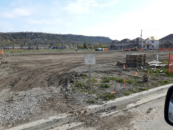 Before: vacant graded lot in Alton Village