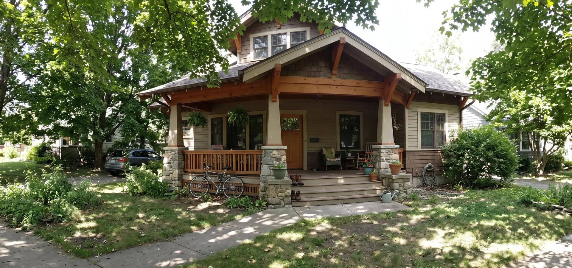 Craftsman custom home with a deep timber porch under mature maples in Roseland