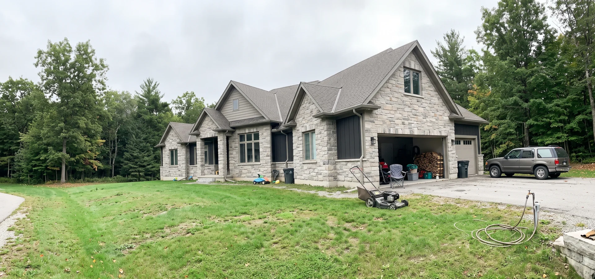 Transitional stone custom home on a large Headon Forest lot