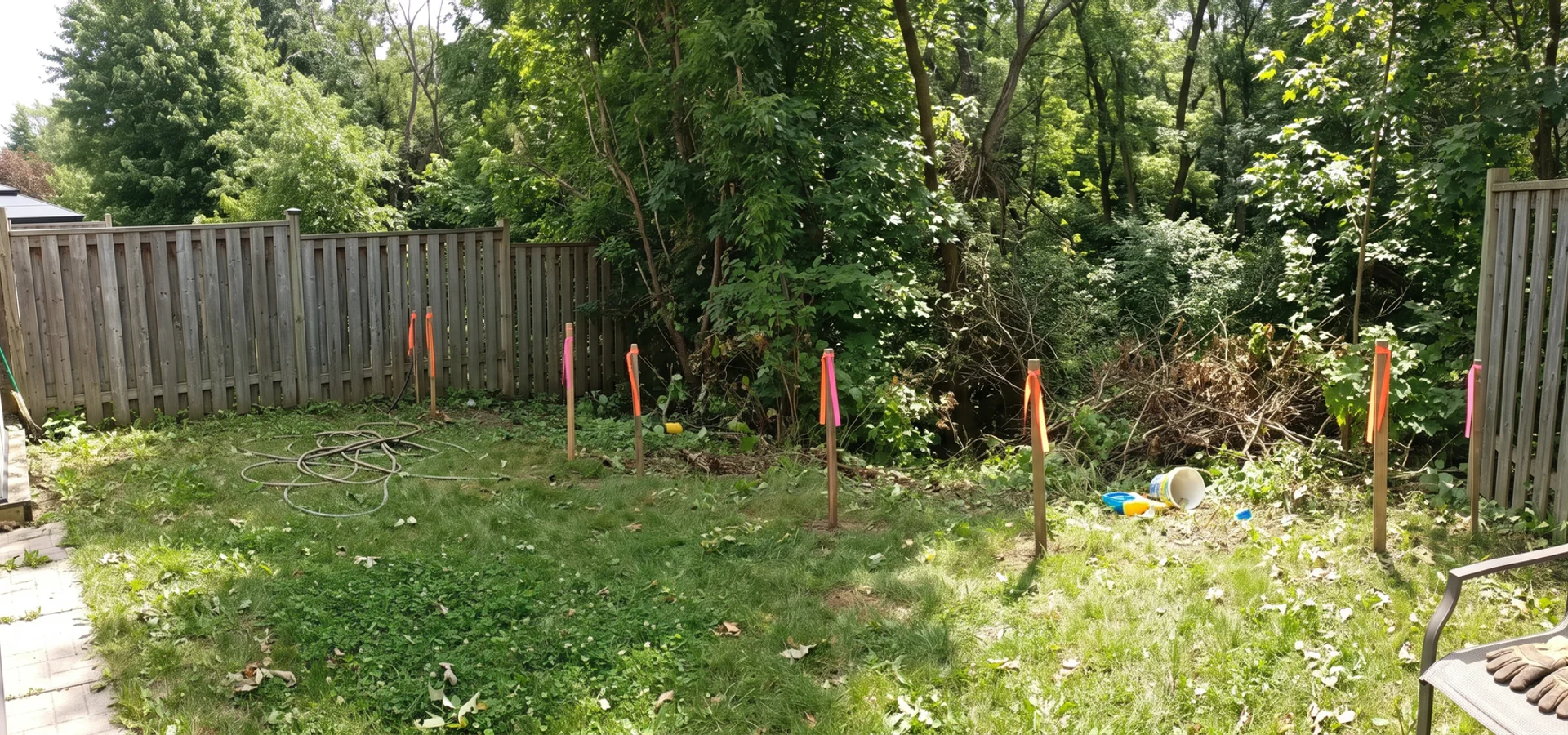 Grindstone Creek ravine edge behind an Aldershot lot with survey stakes marking top of bank